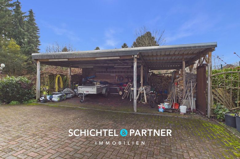 Hambergen | Freistehendes Einfamilienhaus mit Kamin und großem Grundstück – S&amp;P | Carport
