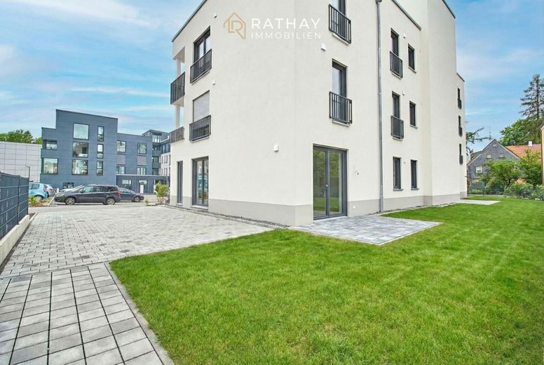 Einzigartige 3-Zimmer Neubauwohnung mit Garten inklusive Küche – Außenansicht mit Garten