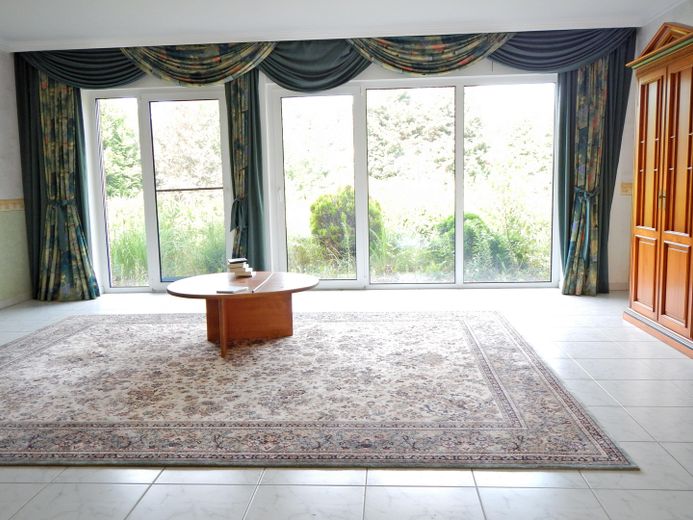 Vermietetes Einfamilienhaus als Kapitalanlage - 15859 Storkow (Mark) Ortsteil Karlslust Seenähe – Wohnzimmer EG