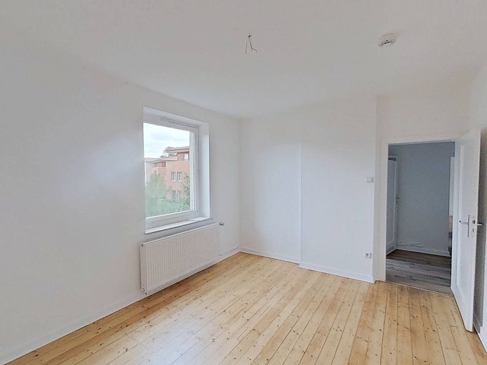 Hübsche 2-Zimmer-Wohnung mit Tageslichtbad in Bielefeld-Mitte – Ansicht II: Wohn- und Esszimm…