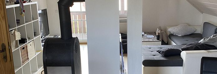 Wohnzimmer mit Holzofen