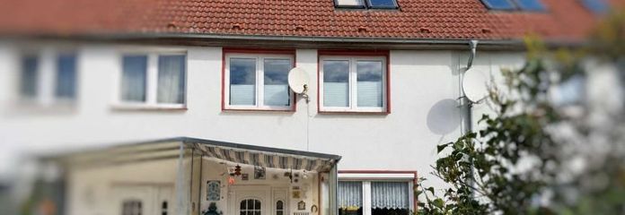 ***La vostra casa di proprietà a Gadebusch – casa a schiera centrale con giardino e potenziale di personalizzazione***
