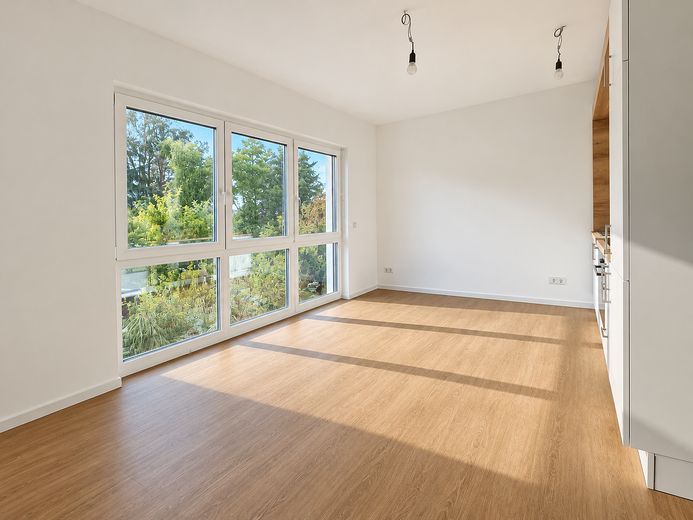 Offene Besichtigung am 10.10.26! Ersbezug im Neubau! Hochwertige 2-Zimmer Wohnung - EH40+QNG-Siegel – Wohnzimmer