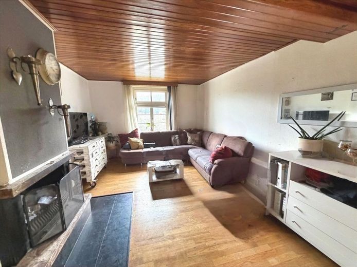 Wohnen mit Weitblick - Mehrfamilienhaus in Dahlerau – Wohnzimmer mit Kamin / EG