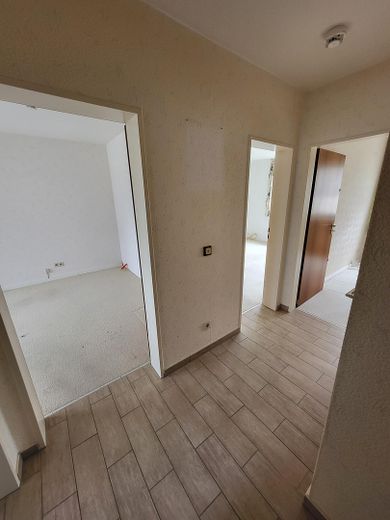 Piso en propiedad de 3,5 habitaciones (92,57 m²) en Harrislee, cerca del centro escolar y las instalaciones deportivas – Flurbereich zu Schlafzimmern