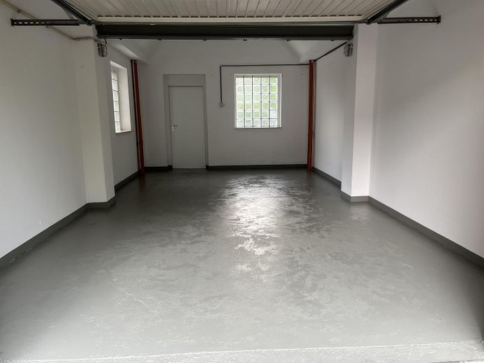 Kernsanierte Gartenwohnung mit Terrasse, Einbauküche und Garage in gefragter Lage von Erkelenz – Garage