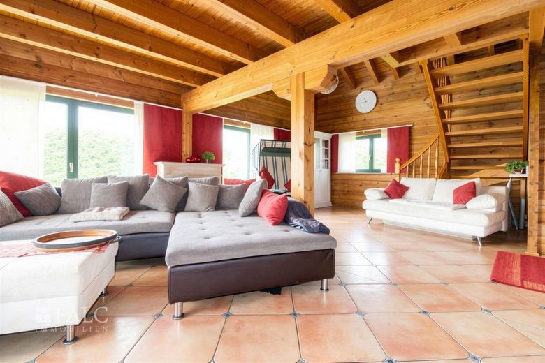 +++ Natur pur &amp; Design: Hochwertiges Fullwood-Wohnblockhaus mit Weitblick in Ostseenähe +++ – Wohnzimmer II
