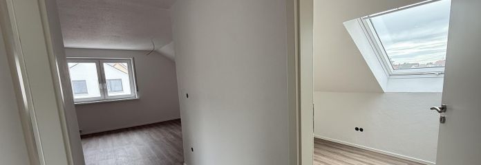 Stylish, completely renovated 1.5-room attic apartment in a central and quiet location in Eching