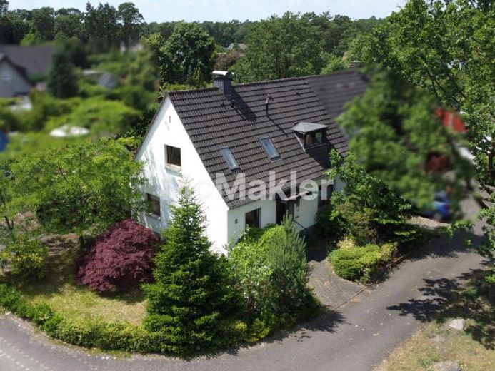 Renovierungsbedürftige Doppelhaushälfte mit rückwärtiger Erholungsfläche in Bielefeld-Senne – Foto 1