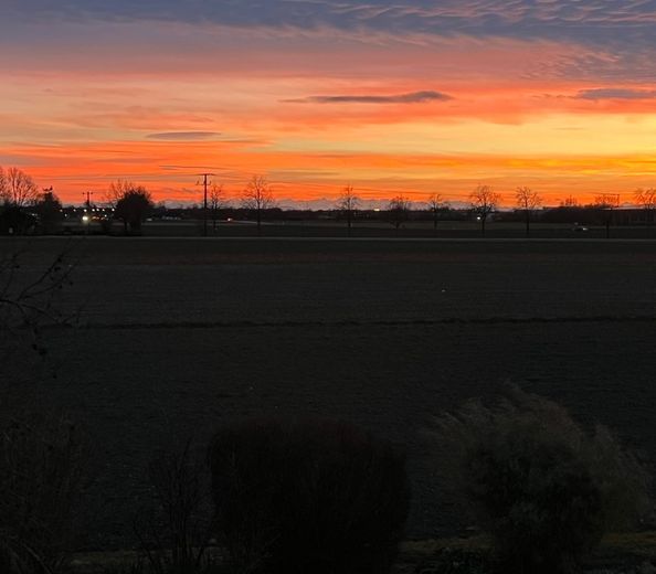 Sonnenuntergang mit Alpenblick