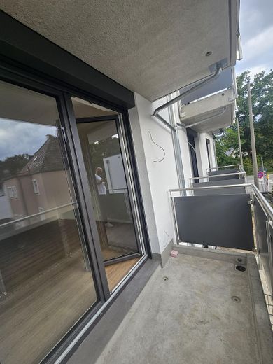 First occupancy attic apartment in the new 8-family house built to KfW 40 standard – Balkon