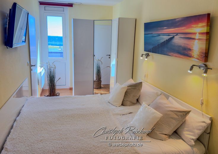 Vista mozzafiato sul Mar Baltico: appartamento vacanze di 2 locali Südstrand Fehmarn – Schlafzimmer mit Bett 1,8x 2 m