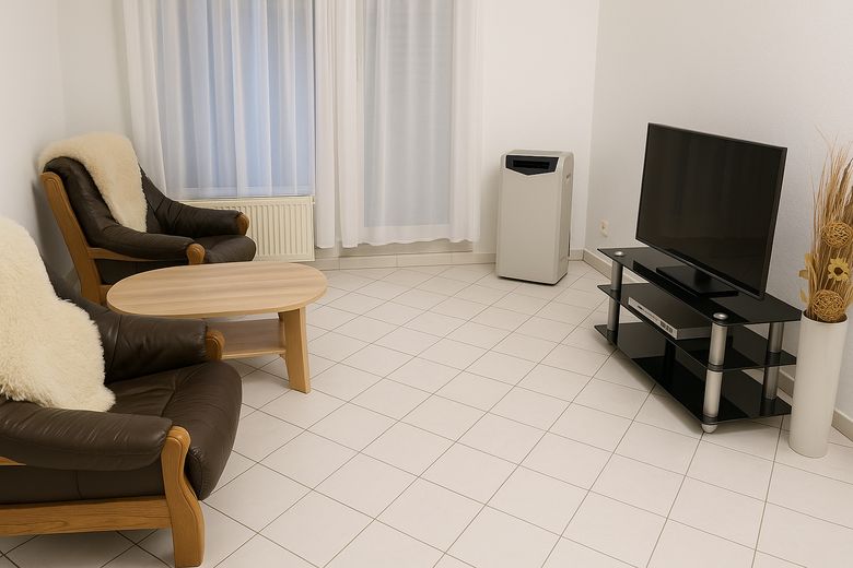 Exklusive 3-Zimmer-Penthousewohnung mit 36 m² Dachterrasse und zwei Stellplätzen – Wohnzimmer