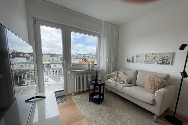 Above the rooftops of Norderney: Stylish 2-room apartment with sunny balcony