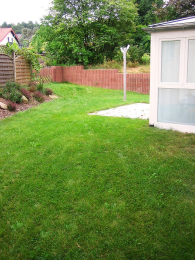 Top-Immobilie für Anleger (Investoren) – Garten Teilansicht