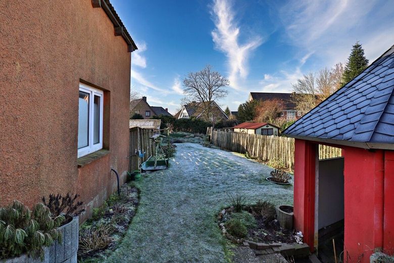 Mehrfamilienhaus mit Ausbaureserve in zentraler Lage von Lunden – Garten