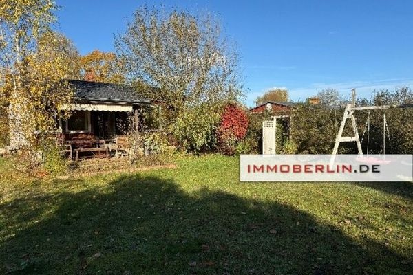IMMOBERLIN.DE - Hübscher Gartenbungalow auf Eigenland in Tiergartensiedlung Oranienburg