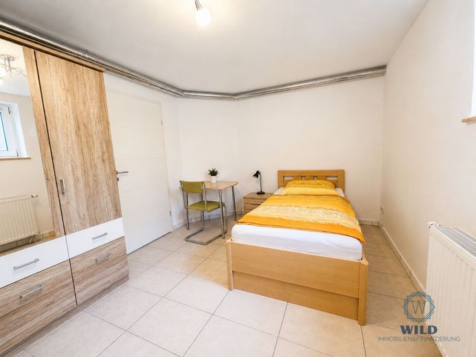 Ein Zuhause mit Zukunft - wertbewusst renoviert, nachhaltig gedacht, in Püttlingen gelegen. – Einliegerwohnung-Schlafzimmer