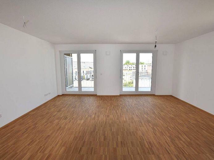 Große 2-Zimmer-Neubauwohnung mit BALKON in verkehrsberuhigter Wohnlage – Ansicht I: Wohn- und Esszimme…