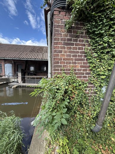 Edificio storico di un mulino con interessanti proventi da locazione – Lage direkt am Wasser