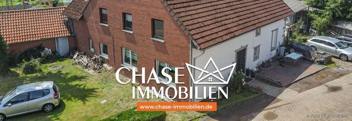 TOP-Chance - Charmantes Einfamilienhaus in guter Lage Lauenhagens - mit diversen Möglichkeiten! – Haus schräg seitliche Ansicht, frontal