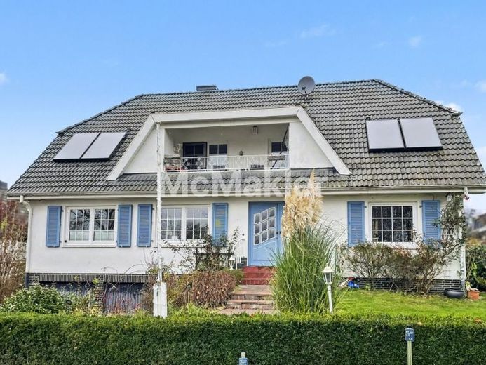 Schnell in der Stadt – zuhause im Grünen: Einfamilienhaus mit Einliegerwohnung und großem Garten – Foto 1