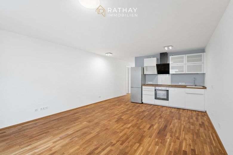Stadtnah wohnen mit Komfort: 2-Zimmer-Erdgeschosswohnung mit Südterrasse &amp; Tiefgarage – Wohnbereich