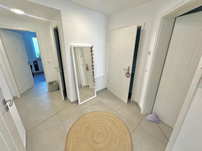 Moderno piso de 3 habitaciones en planta baja con jardín, eficiencia energética A+ – Entrée