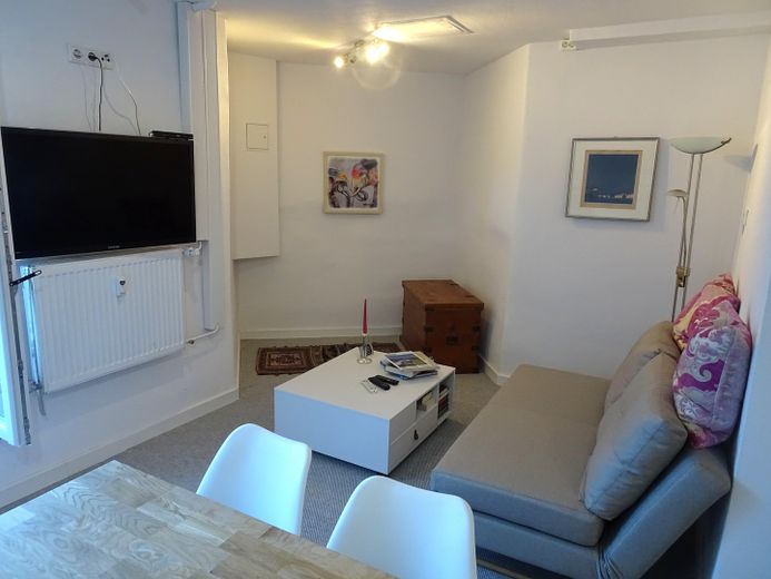 Wohnzimmer mit Schlafsofa