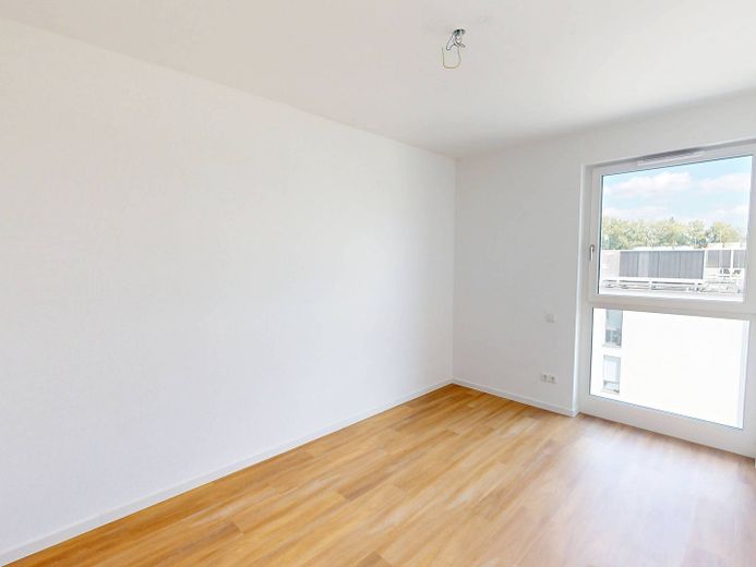 Moderniteit en comfort: nieuwbouwappartement met 4 kamers, inbouwkeuken en groot dakterras – Ansicht I: Schlafzimmer I