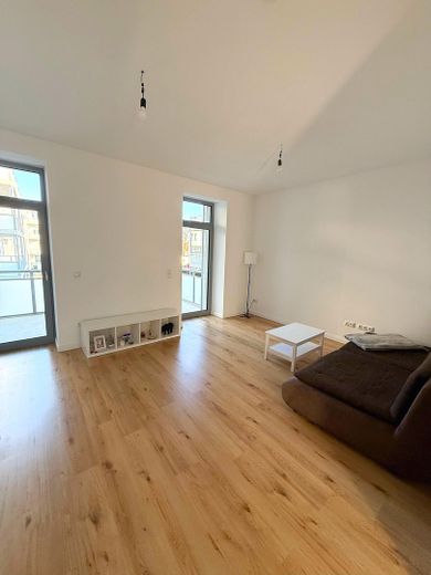 LUSSO vicino all’Elba: esclusivo appartamento di 2 locali con balcone e riscaldamento a pavimento *standard di nuova costruzione* – helles Wohnzimmer