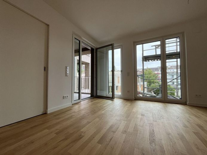 First occupancy in the new build! Modern 2-room apartment with QNG-Plus seal and fitted kitchen! – Wohnzimmer
