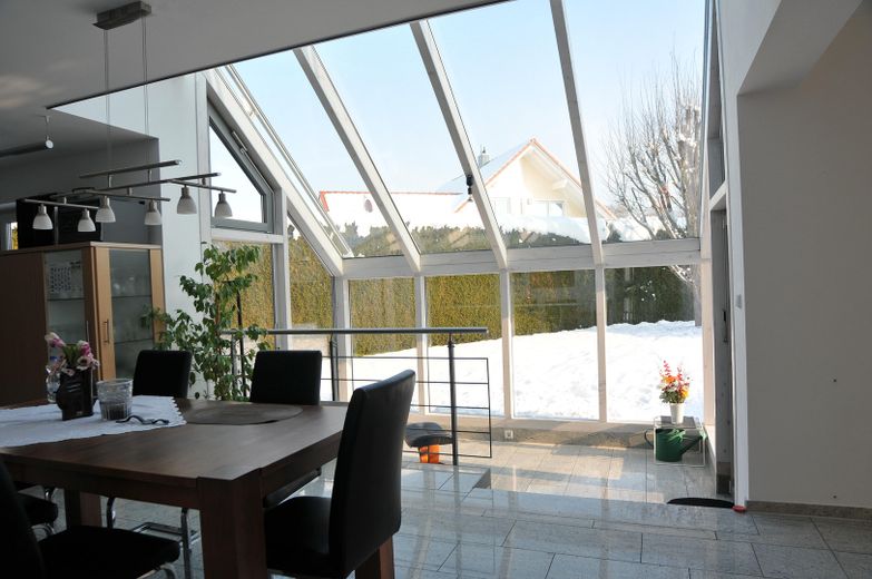 Modern architect-designed house for the large family – Wintergarten von EG