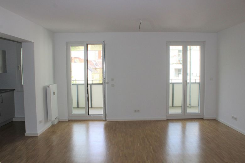 Ampio trilocale di nuova costruzione, libero e pronto per essere abitato, con spazioso balcone – Wohnzimmer
