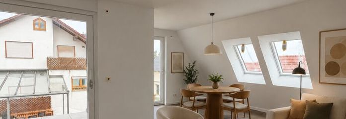 Eleganz und Weitblick – Dachgeschosswohnung mit einem Balkon und luxuriösem Design