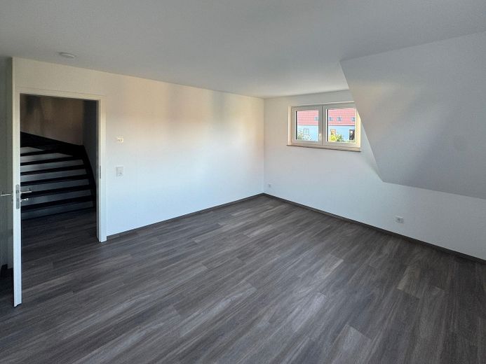 Almost finished: semi-detached house with garden & fireplace near Dresden – Wohnbeispiel Schlafzimmer