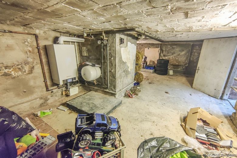 2x Einfamilienhäuser mit Entwicklungspotenzial - Teilvermietete Kapitalanlage in Rollshausen! – Haus 1 Keller + Heizung