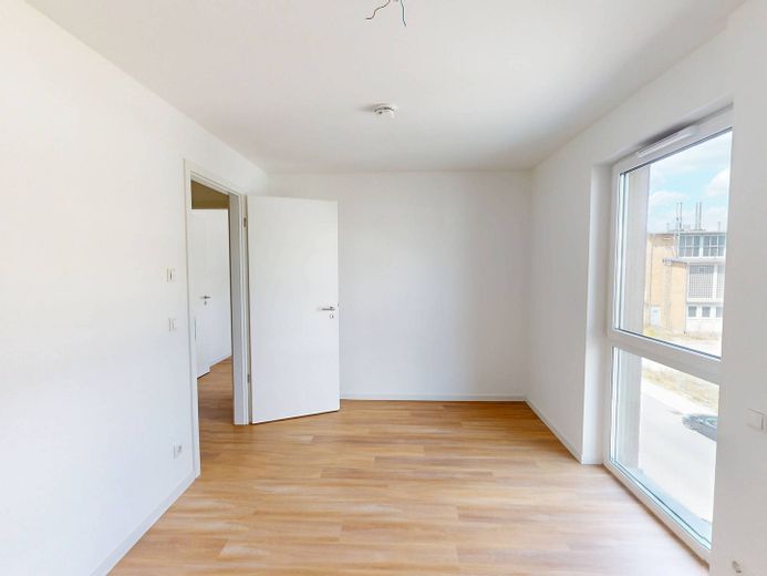Modern wooncomfort: Lichtovergoten nieuwbouwappartement met 3 kamers, BALKON en INBOUWKKEUKEN – Ansicht II: Schlafzimmer I