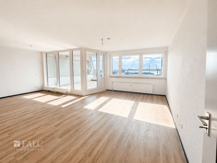 Top Lage direkt an der Weser - Penthouse-Feeling zum verlieben! – Großes, einladendes Wohnzimmer