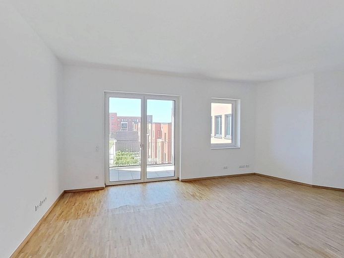 2-Zimmer-Neubauwohnung mit EINBAUKÜCHE und BALKON im Erstbezug *HERBSTSPECIAL: 13. Monatsmiete FREI* – Ansicht II: Wohn- und Esszimm…