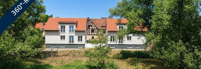 Wohnen am Fluss: Modernes Neubau-Massivhaus in begehrter Uferlage mit Panoramablick