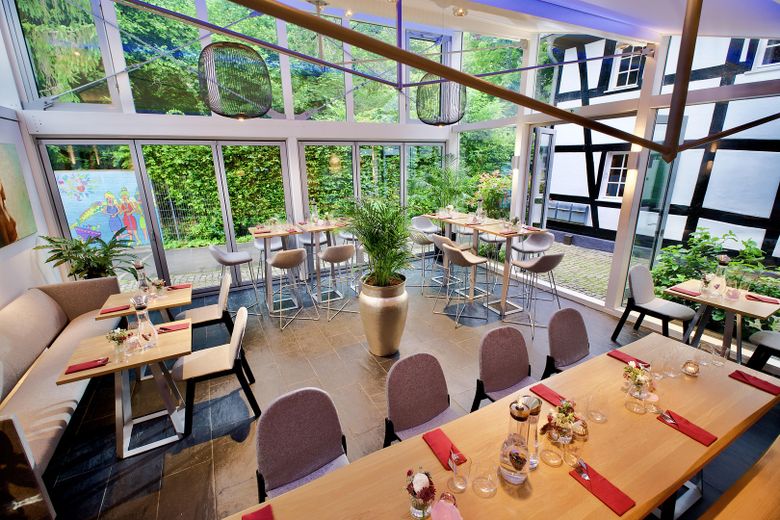 Die Buchmühle: Ubicación para eventos y negocios · Sala de exposición · Loft y diseño · Bienestar – Gartensalon Blick Garten