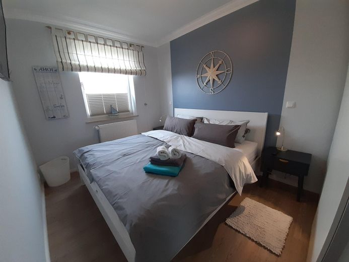 ##Reserviert## Sonnige 2-Zimmer Ferienwohnung mit Meerblick – Schlafzimmer