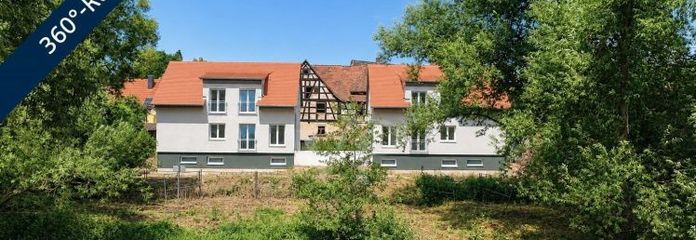 Wohnen am Fluss: Modernes Neubau-Massivhaus in begehrter Uferlage mit Panoramablick