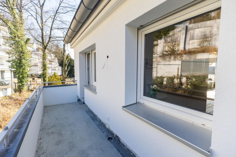 Ihre Traumwohnung in direkter Nähe zum Unterbacher See! WE 15 – Balkon Küche Rückseite