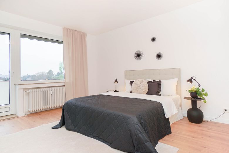 Schlafzimmer mit Balkonzugang