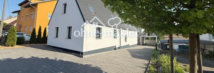 Modernisiertes Einfamilienhaus mit separatem Wohnbereich und großem Garten in Lonnerstadt