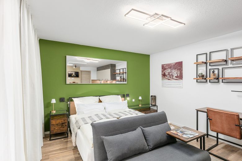 Neubau: vollmöblierte Businessapartments mit Panoramablick – Apartment 6 Schlafbereich 