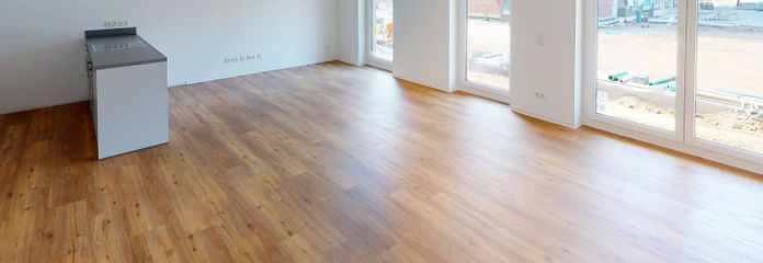 Helle 4-Zimmer-Wohnung mit EBK, 2 BÄDERN und TERRASSE im Neubauquartier FIELD 4 – Ansicht I: Wohn- und Esszimme…