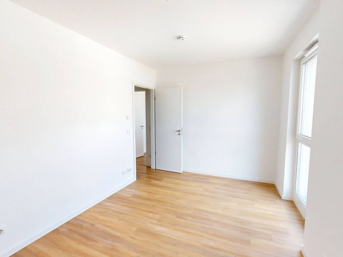 Moderniteit en comfort: nieuwbouwappartement met 4 kamers, inbouwkeuken en groot dakterras – Ansicht II: Schlafzimmer II
